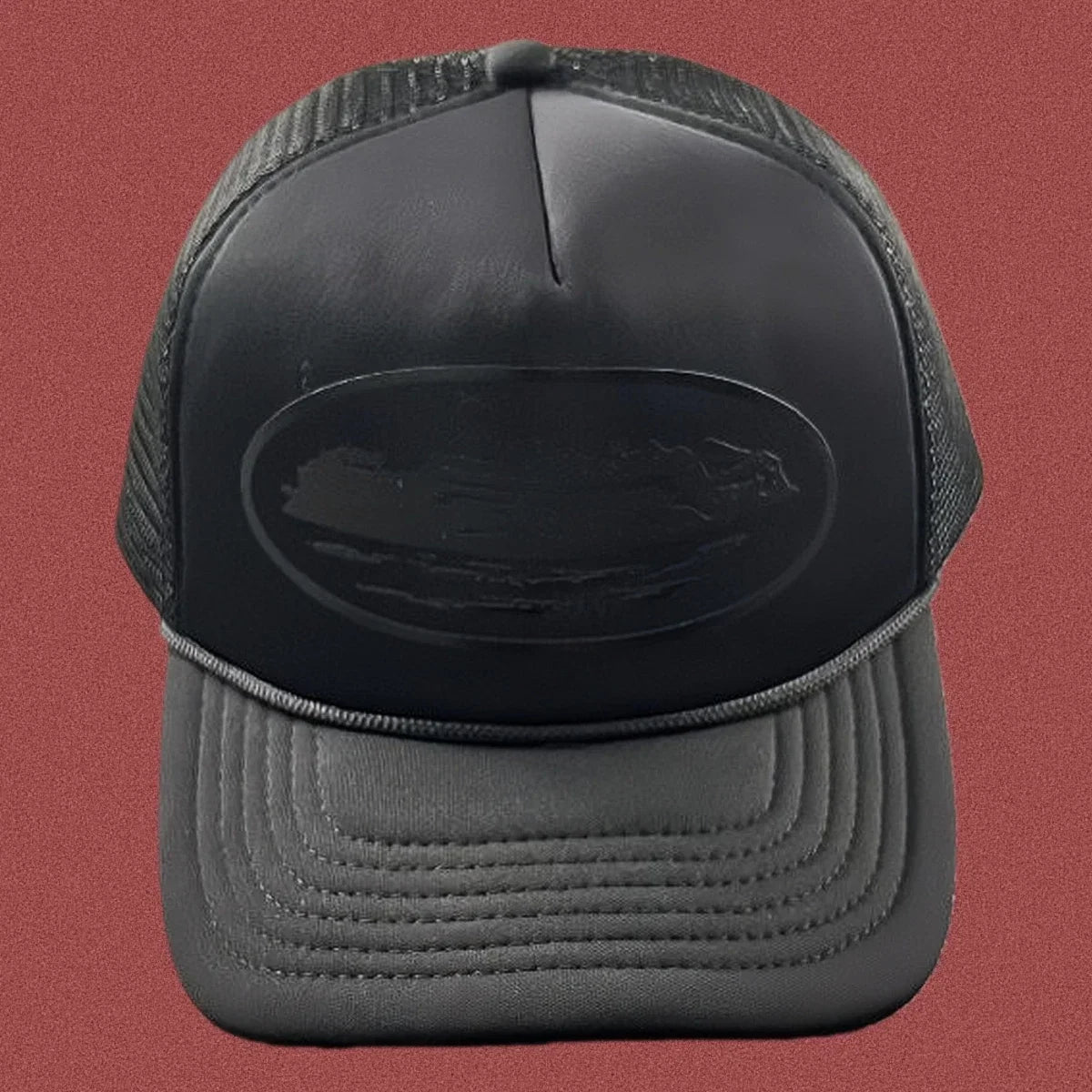 Corteiz All-Black Monochromatic Oval Ship Logo Trucker Hat